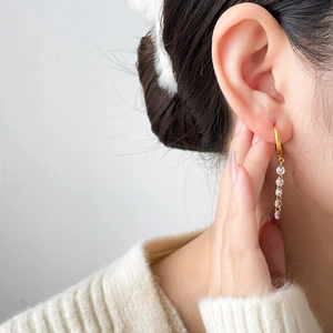 Long tassel drop earrings in 18K gold plated titanium steel with zircon crystals