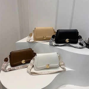 Minimalist textured leather crossbody bag with jacquard strap in four elegant colors
