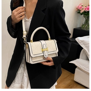 Chic cream white handbag with delicate lace embossed pattern and elegant gold H-clasp
