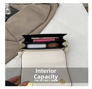 Top view of white crossbody bag showing dual compartments and spacious interior storage
