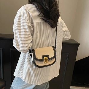Minimalist canvas and PU leather saddle bag with contrast stitching and golden hardware