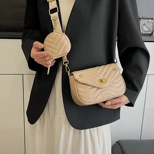 Quilted beige crossbody bag set with wide strap and round coin purse on model