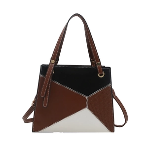 Contrast color block handbag with animal print texture and gold ring hardware