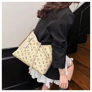 Detail of beige tote bag featuring cute cartoon bear prints and stylish long straps