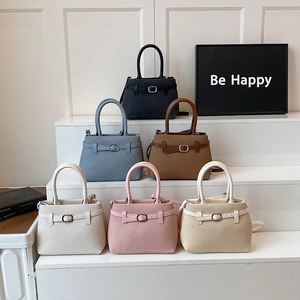 Fashionable large capacity handbags in six colors on white steps for women