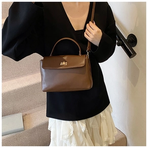 Brown soft leather crossbody bag shown on model for daily street style look