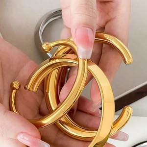 Polished hollow 18K gold-plated geometric thick cuff bracelet with open round arc design