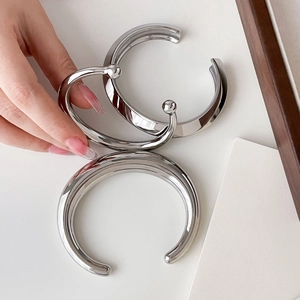 Minimalist silver geometric open bangle set with polished stainless steel finish