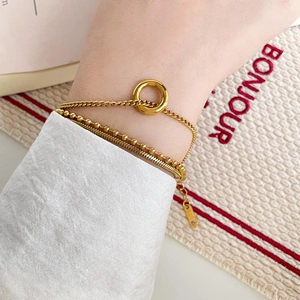 Three-layer 18K gold plated punk style chain bracelet with K18 tag worn on wrist