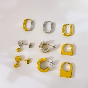 Minimalist geometric earring set in gold and silver steel with U-shape and ball charms