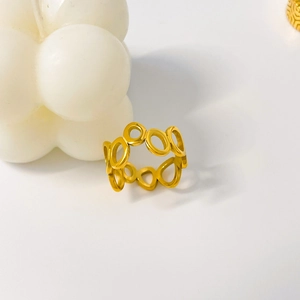 Detail of 18K gold-plated titanium steel ring with hollow gear link chain design