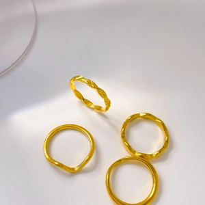 Set of four 18K gold plated titanium steel rings with wave lines and engraved patterns