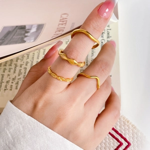 Set of four 18K gold plated titanium wavy and twisted stackable rings for women
