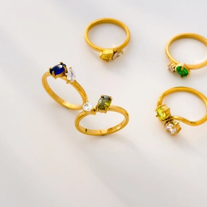 Set of five 18K gold plated titanium rings featuring colorful double zircon inlays