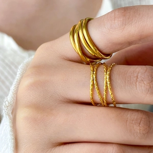 Chic multi-layer crisscross gold rings for women in textured and smooth spiral styles