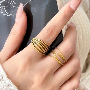 Golden multi-layer wide hollow ring and twisted wire band set with frosted texture