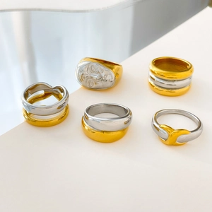 Two-tone chunky stainless steel rings set featuring face relief and layered hollow designs