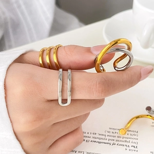 Two-tone titanium steel ring set with gold and silver interlaced minimalist twist designs