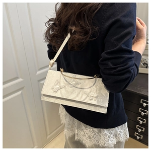 Lace handbag with 3D butterfly embroidery shown on model for elegant style