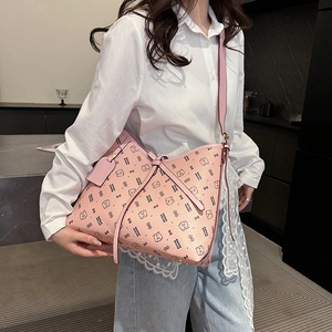Pink large tote bag with bear print and bow detail shown in lifestyle setting