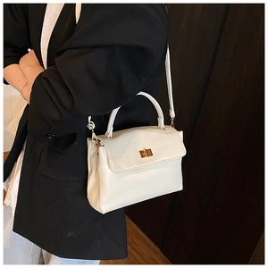 White soft PU leather square bag with gold metal buckle shown on a professional blazer
