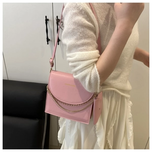 Pink faux leather crossbody bag with double gold chain and mini accessory pouch