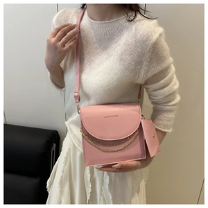 Pink PU leather shoulder bag featuring dual chain details and matching mini coin purse