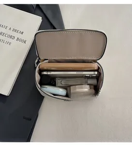 Interior view showing the spacious capacity of the white snakeskin chain vanity bag