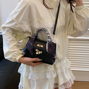 Classic black crocodile pattern Kelly bag with floral silk scarf and gold metal hardware