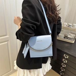 Fashion light blue chain crossbody bag with small pouch shown on female model