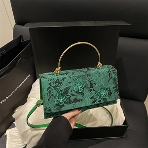 Vintage green lace handbag with butterfly embroidery and gold metal ring handle
