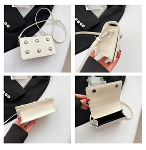 Detail shots of white patent leather punk bag with large silver studs and quilted texture