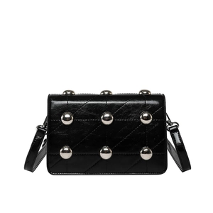 Punk style black quilted crossbody bag with silver rivets and shiny leather finish