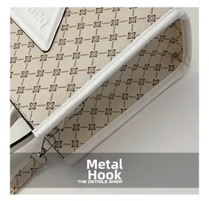 Detail of the high-quality silver metal hook and leather edging on the floral tote bag