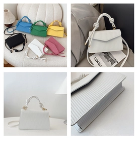 Détail de texture cuir verticale avec poignée décorative à nœud sur sac bandoulière chic
