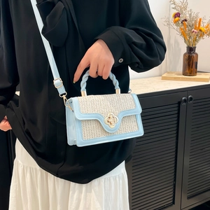 Woven flower lock handbag in beige and light blue with gold metallic hardware