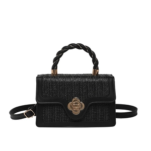 Chic black woven square crossbody bag with gold floral clasp and woven top handle