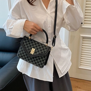Elegant grey monogram handbag for women with gold clasp and white contrast stitching