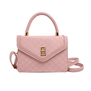 Pink crossbody bag with M-letter print and gold lock shown in a front view