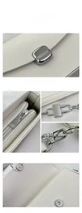 Macro detail of white lychee grain leather handbag with premium silver metal hardware
