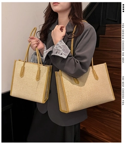 Detail of woven straw tote bag in two sizes showing khaki trim and minimalist texture