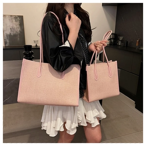 Close-up of pink woven tote bag set showing detailed texture and leather-like trim