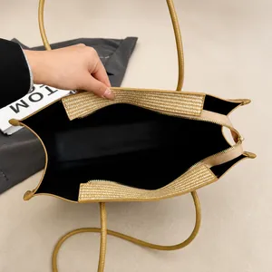 Top view of large capacity tote bag with woven trim detail and spacious interior compartment