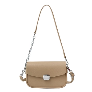 Chic beige lychee grain saddle bag with silver metal buckle and chain strap on white background