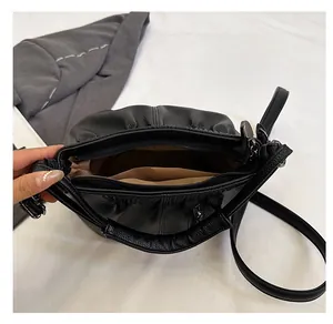 Top view showing the spacious interior and multiple compartments of this black tote bag