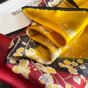 Silk square scarf featuring red and yellow plum blossom prints with black borders