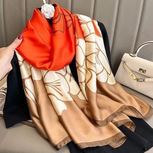 Floral satin silk scarf in bright orange and beige with abstract flower prints for women