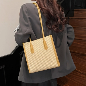 Retro woven straw tote bag with mustard yellow leather straps and spacious square shape
