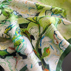 Detail of silk scarf with oil painting pattern showing smooth texture and fine hem edges