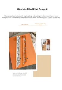 Detail view of premium twilly scarves with vintage key and chain print in 5x85cm size